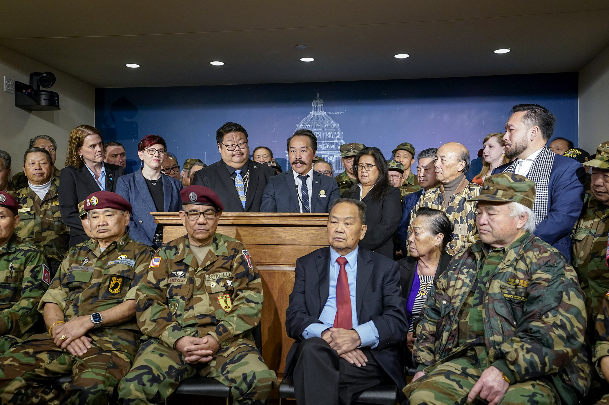 Rep. Ethan Cha discusses a provision in the omnibus veterans and military affairs finance and policy bill during an April 29 news conference that would grant veteran status under state law to certain people who served with secret guerilla units or other irregular forces in Laos in Special Guerrilla Units during the Secret War in Laos. (Photo by Michele Jokinen)